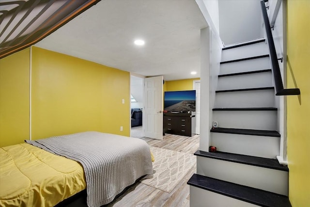 bedroom with light wood-style flooring and recessed lighting