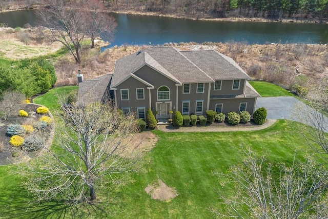 10 Deer Run Dr, Westford, MA 01886 - view of front facade with a water view, roof with shingles, and a front yard
