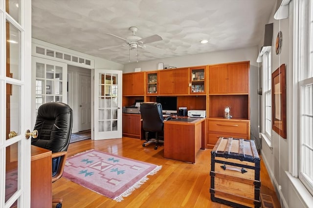 10 Deer Run Dr, Westford, MA 01886 - office area with plenty of natural light, ceiling fan, french doors, and light wood-style flooring