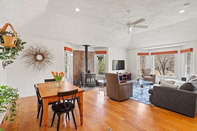 10 Deer Run Dr, Westford, MA 01886 - living room featuring a ceiling fan, a wealth of natural light, a wood stove, and light wood-style floors