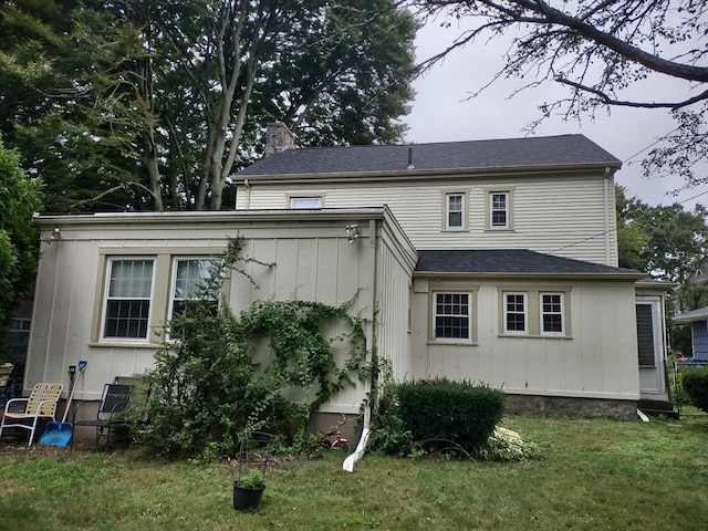 54 Hawthorn St, New Bedford, MA 02740 - back of house featuring a yard and a chimney