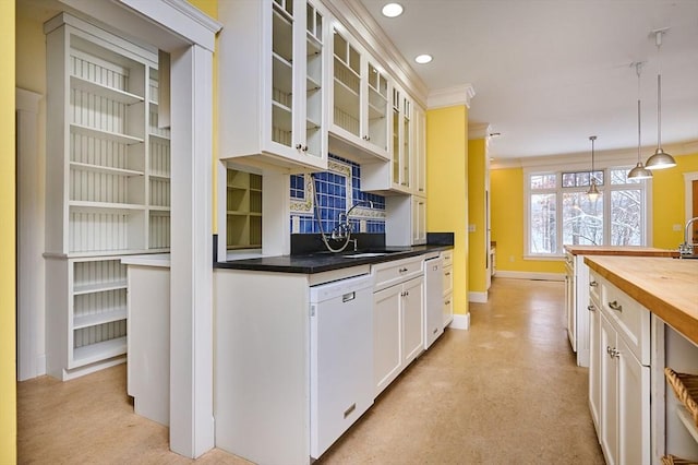 kitchen featuring white cabinetry, white dishwasher, butcher block counters, and decorative light fixtures