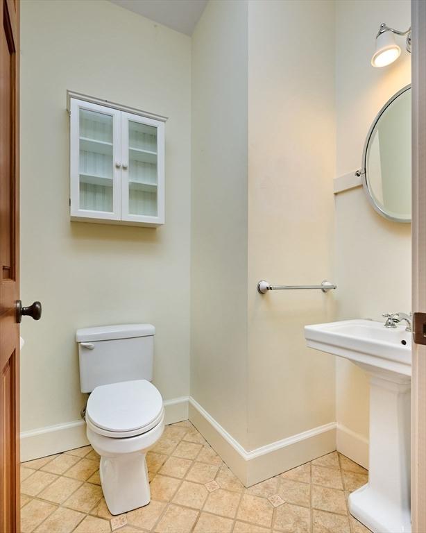 bathroom featuring tile patterned floors and toilet