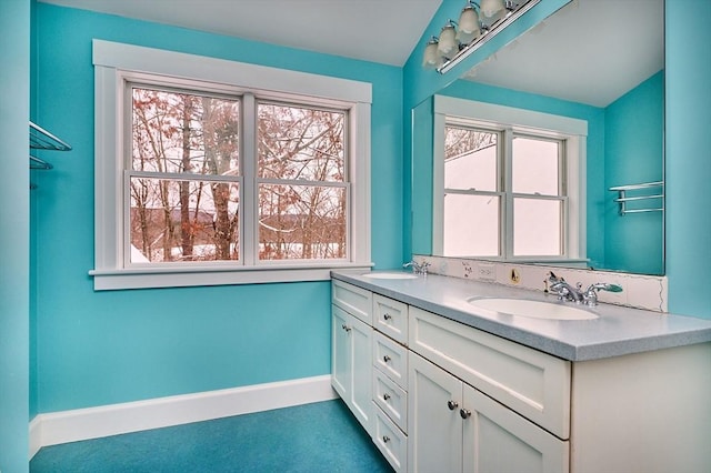 bathroom with vanity and plenty of natural light