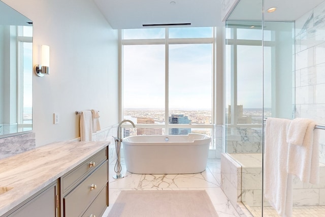 bathroom with separate shower and tub, tile flooring, and vanity