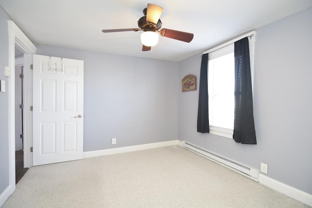 carpeted spare room featuring ceiling fan, baseboards, and baseboard heating