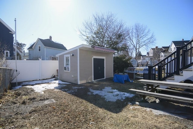 exterior space featuring fence and stairs