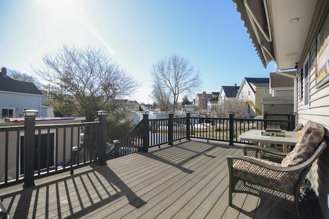 wooden terrace featuring a residential view