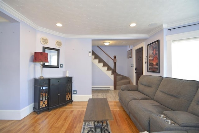 living room with ornamental molding, light wood-type flooring, stairway, and baseboards