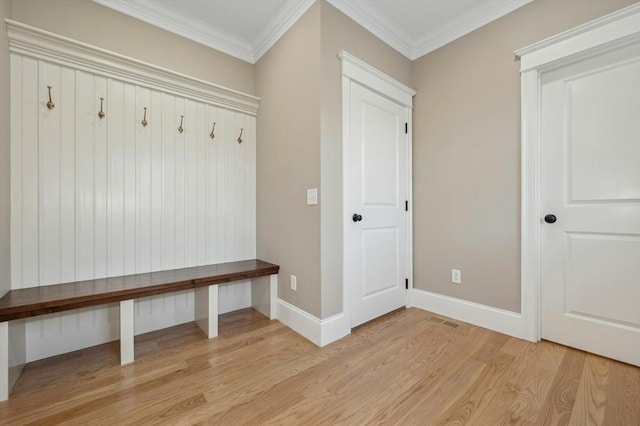 mudroom with crown molding and light hardwood / wood-style floors