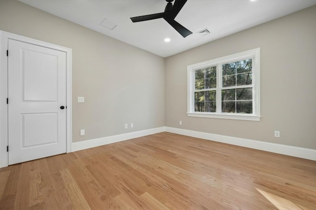 unfurnished room with ceiling fan and light hardwood / wood-style floors