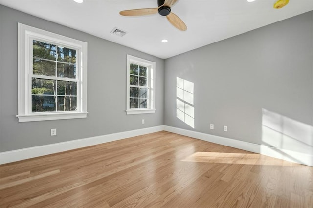 spare room featuring ceiling fan and light hardwood / wood-style floors