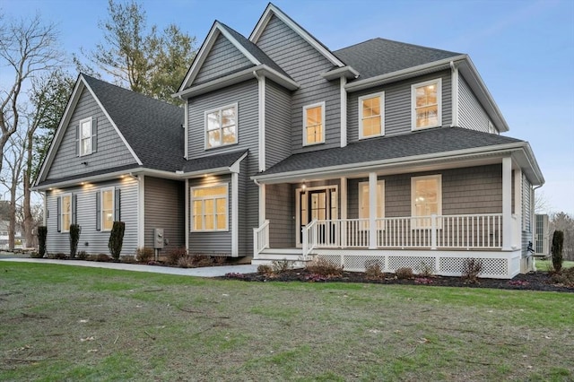 view of front of house featuring a front yard and a porch