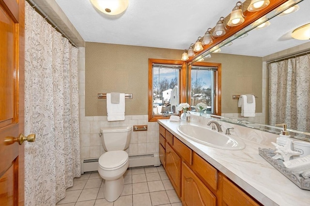 bathroom featuring a baseboard radiator, tile walls, tile patterned floors, and toilet