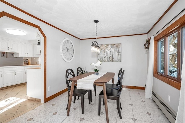 dining space with a baseboard radiator and ornamental molding