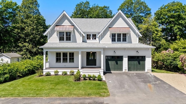 233 Warren St, Needham, MA 02492 - view of front of home featuring asphalt driveway, a garage, covered porch, a front yard, and a shingled roof