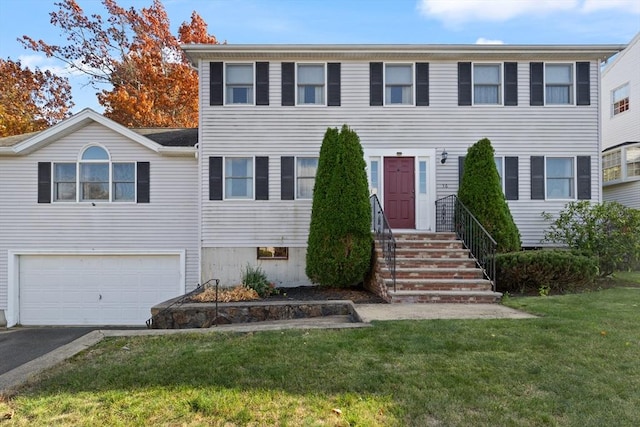 36 Emerald Dr, Lynn, MA 01094 - view of front facade featuring an attached garage, a front yard, and driveway