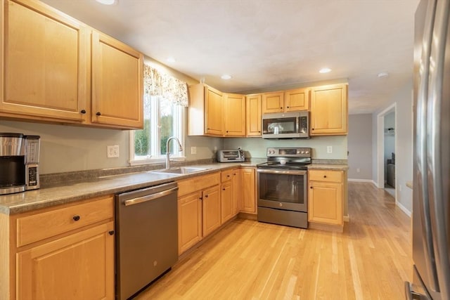 36 Emerald Dr, Lynn, MA 01094 - kitchen with stainless steel appliances, light brown cabinetry, light wood-style flooring, and recessed lighting