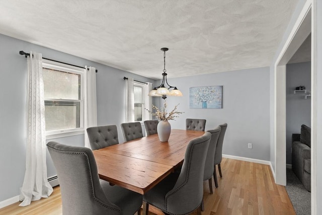 36 Emerald Dr, Lynn, MA 01094 - dining space with light wood finished floors and a textured ceiling
