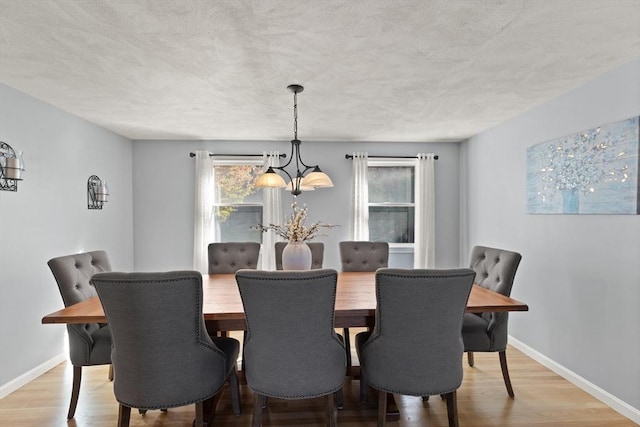 36 Emerald Dr, Lynn, MA 01094 - dining room featuring a chandelier, light wood finished floors, and a textured ceiling
