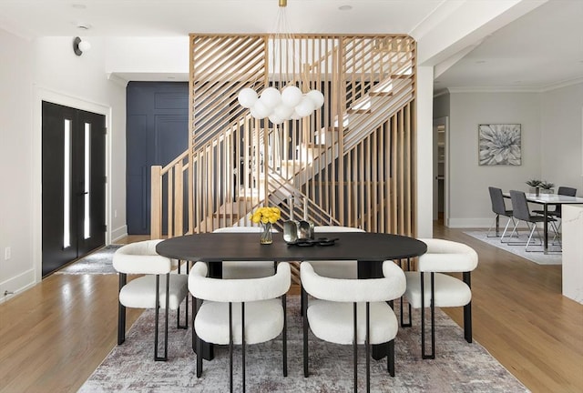 54 Stone Rd, Sudbury, MA 01776 - dining room with stairway, wood finished floors, baseboards, and ornamental molding