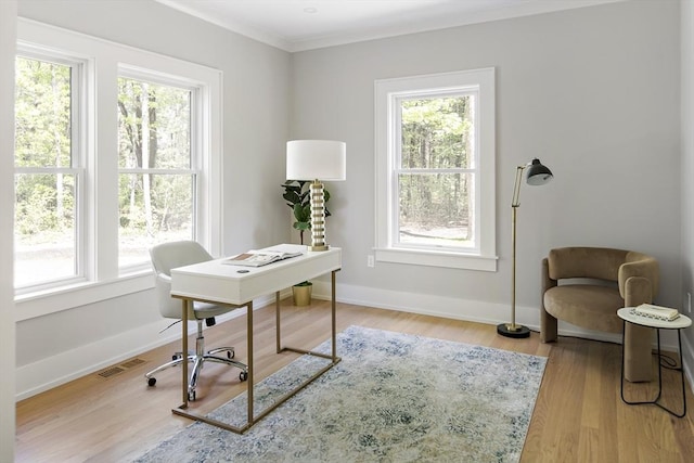 54 Stone Rd, Sudbury, MA 01776 - home office featuring plenty of natural light, wood finished floors, baseboards, and ornamental molding