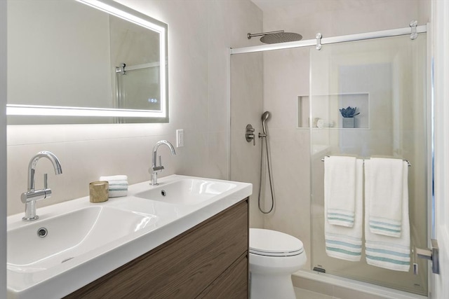 54 Stone Rd, Sudbury, MA 01776 - bathroom featuring a shower stall, double vanity, and toilet