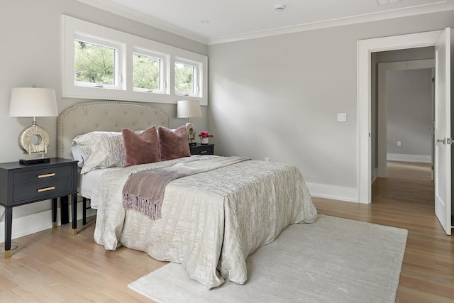 54 Stone Rd, Sudbury, MA 01776 - bedroom with light wood-style flooring, ornamental molding, and baseboards