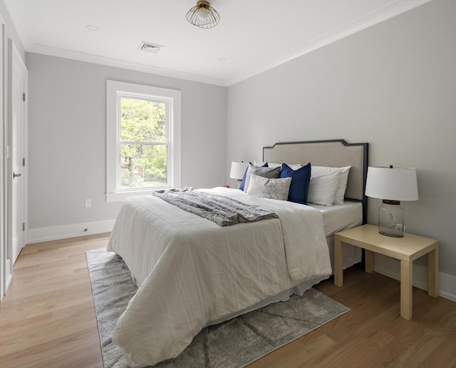 54 Stone Rd, Sudbury, MA 01776 - bedroom with light wood-type flooring, ornamental molding, and baseboards