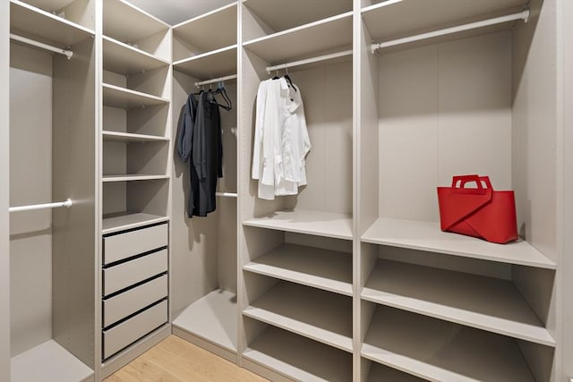 54 Stone Rd, Sudbury, MA 01776 - walk in closet with wood finished floors