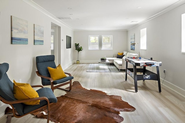 54 Stone Rd, Sudbury, MA 01776 - living room featuring light wood-style floors, baseboards, and ornamental molding