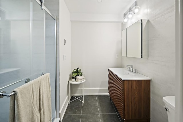 54 Stone Rd, Sudbury, MA 01776 - full bath with vanity, tile patterned floors, toilet, a shower stall, and baseboards
