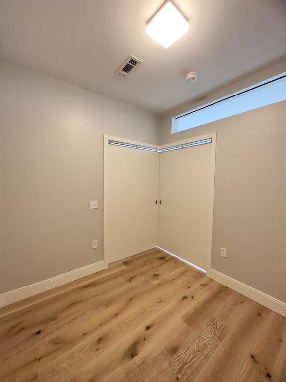 spare room featuring hardwood / wood-style floors