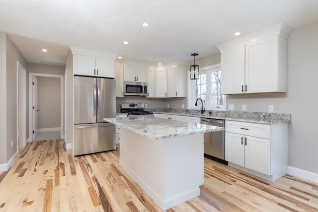 261/2 Cherry St, Spencer, MA 01562 - kitchen featuring white cabinets, stainless steel appliances, light wood finished floors, and recessed lighting