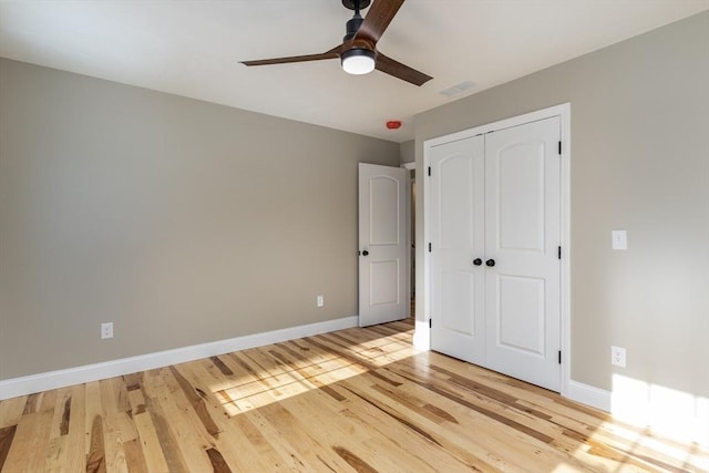 261/2 Cherry St, Spencer, MA 01562 - unfurnished bedroom with visible vents, baseboards, wood finished floors, and a closet