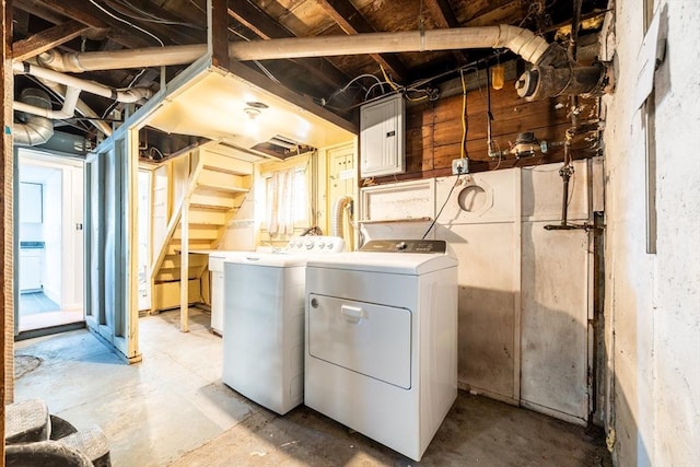 laundry room featuring laundry area, separate washer and dryer, and electric panel