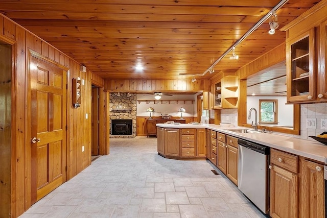 1 Sheffield Cir, Andover, MA 01810 - kitchen with dishwasher, track lighting, wooden walls, a stone fireplace, and stone finish flooring