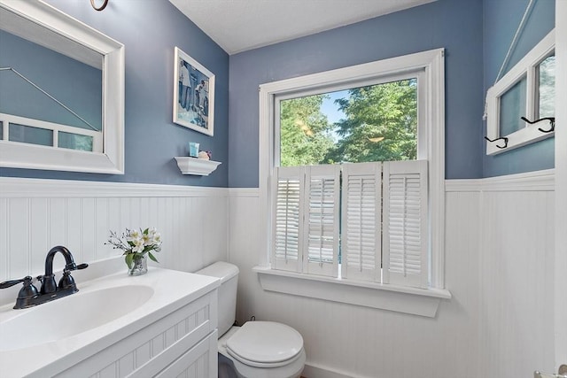 1 Sheffield Cir, Andover, MA 01810 - half bath featuring a wainscoted wall and vanity