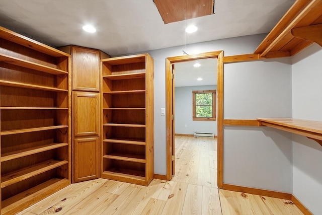1 Sheffield Cir, Andover, MA 01810 - walk in closet featuring light wood-style floors and a baseboard heating unit