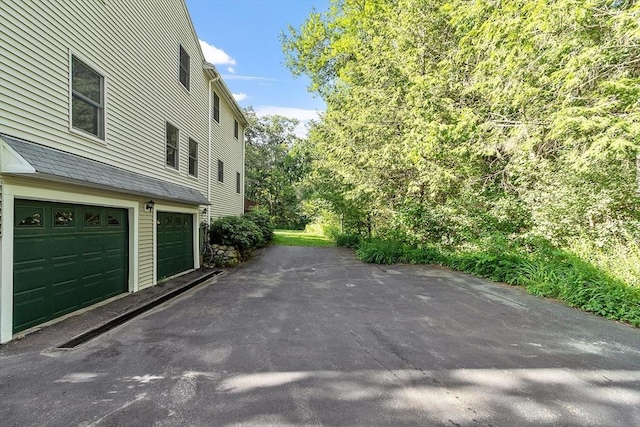 1 Sheffield Cir, Andover, MA 01810 - view of property exterior featuring asphalt driveway