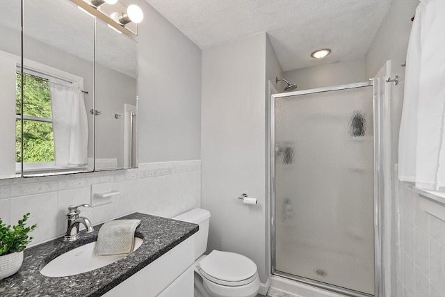 1 Sheffield Cir, Andover, MA 01810 - bathroom featuring tile walls, a shower stall, vanity, a textured ceiling, and wainscoting