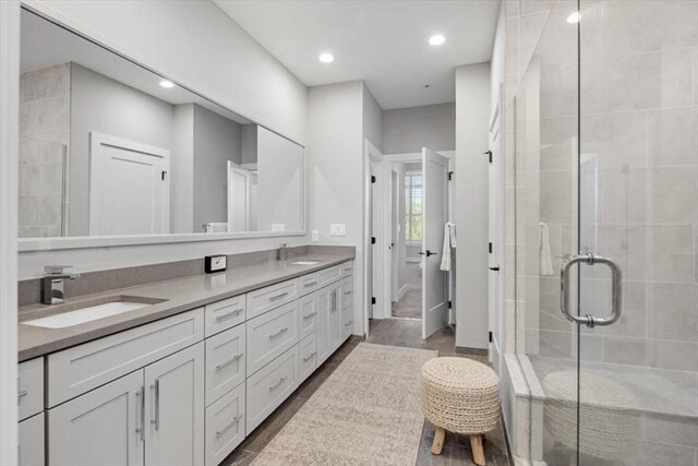 21 Brand Blvd Unit 21, Scituate, MA 02066 - bathroom featuring a stall shower, double vanity, and recessed lighting