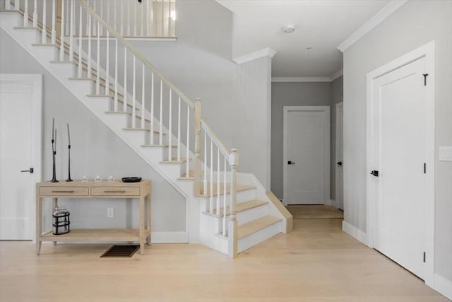 21 Brand Blvd Unit 21, Scituate, MA 02066 - staircase with wood finished floors, crown molding, baseboards, and a towering ceiling