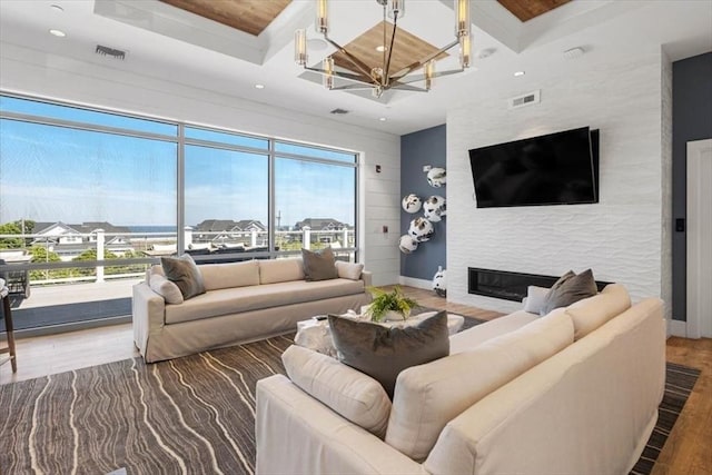 21 Brand Blvd Unit 21, Scituate, MA 02066 - living room with coffered ceiling, a fireplace, wood finished floors, beamed ceiling, and recessed lighting