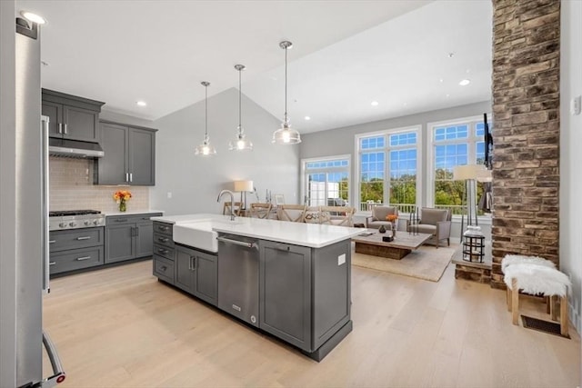 21 Brand Blvd Unit 21, Scituate, MA 02066 - kitchen with a sink, stainless steel appliances, gray cabinets, light wood-style floors, and light countertops