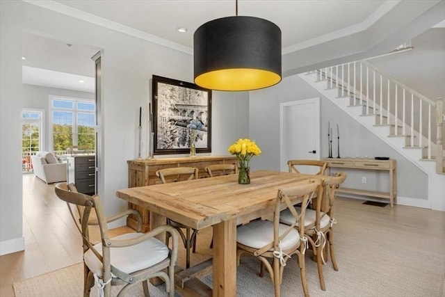 21 Brand Blvd Unit 21, Scituate, MA 02066 - dining area featuring light wood finished floors, stairs, ornamental molding, and baseboards