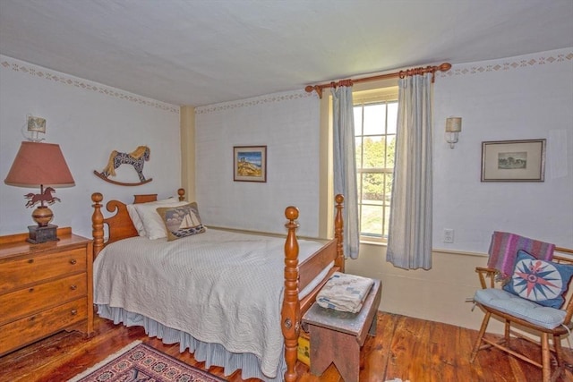 bedroom with wood finished floors