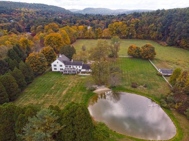 bird's eye view with a water view and a forest view