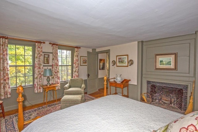 bedroom with a high end fireplace
