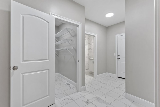 168 Justice Hill Rd Oakmont, Unit Oakmont, Sterling, MA 01564 - bathroom featuring marble look tiles and baseboards